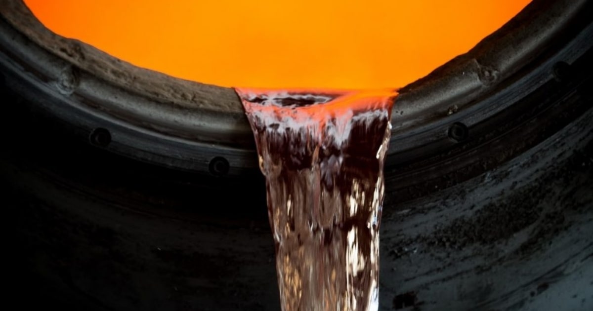 Molten aluminium being poured from a furnace during the gravity die casting process at OZBROS LTD’s production facility.