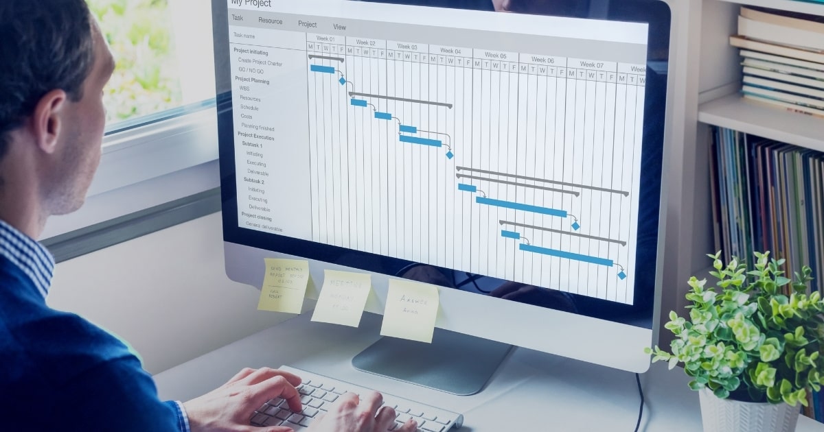 Engineer managing a project timeline on computer screen as part of OZBROS Project Management service process.